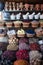 Colorful spices nuts dried flowers minerals and pestle for cooking at open air spice market