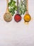 Colorful spices in a wooden spoon with herbs, tandoori, oregano, curry border ,place for text wooden rustic background top vie