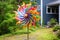 colorful spinning wind art piece in garden