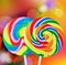 Colorful spiral lollipop isolated on a colored