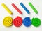 Colorful spiral plasticine, multicolored sticks clay dough, white background