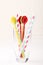 Colorful spoon and stripped straw in clear glass