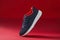 Colorful sport footwear or shoes on red color backround. Running fashion sneaker for fitness and training.