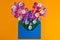 Colorful spring flowers in envelope, flower delivery and love concept
