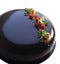 Colorful spring strawberry and pistachio chocolate cake with mirror glaze, strawberry jelly and raw pistachios