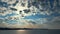 Colorful spring summer landscape on river with beautiful clouds in the sky evening time, shooting from a car that goes on the road