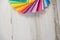 Colorful stack of sample swatches for paint or fabric in spectrum rainbow colors