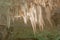 Colorful Stalactites by Cave Lighting