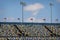 Colorful stands at Daytona 500 racetrack on summer day.