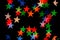 Colorful star shape boke on dark background