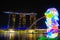 Colorful statue of Merlion on the background of the famous hotel of Singapore - Marina Bay Sands