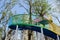 Colorful steel footbridge spiraling up in blue sky of sunny winter noon