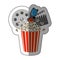 colorful sticker with popcorn cup with cinematography tape and clapper board