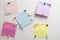 Colorful stickers for notes are attached wall with help stationery buttons.