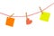 Colorful stickies hanged on red rope
