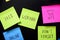 Colorful sticky notes on black board reminder. Free webinar written sticker on pineboard. Register for free online webinar