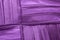 Colorful Stitching Forming Pattern on Mauve Fabric