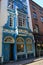 Colorful stone and brick fronts of hotels and stores on busy streets, Limerick, Ireland, October, 2014