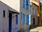 Colorful and stone houses in narrow street in Alacati cesme