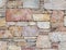 Colorful stonewall close up, seamless natural background