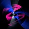 Colorful straight  arched and zigzag blades of an abstract propeller spin against a black background. Graphic design element. 3d