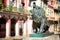 Colorful street in Old Havana with the bronze lion at El Prado