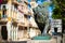 Colorful street in Old Havana with the bronze lion at El Prado