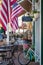 A colorful street scene with storefronts and outdoor cafÃ© seating along the public square in Dahlonega, Georgia