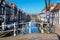 Colorful street view with houses and canal in Delft, Holland