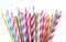 Colorful striped drinking straws on white background