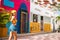 Colorful stroll: Latina woman exploring the vibrant streets of Riohacha, Colombia