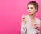 Colorful Studio portrait of young beautiful woman looking in the direction of free space