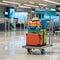 Colorful Suitcases and Hat on Trolley in Modern Airport Terminal