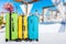 Colorful suitcases stack on nature background