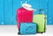Colorful suitcases stack on wooden background