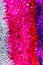 Colorful Sukkot or Sukkos or Christmas tinsel. New year`s fluffy gold, purple, silver, yellow, pink tinsel.
