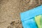 Colorful summer beachwear . towel on sand beach.