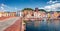 Colorful summer cityscape of Bosa town with Ponte Vecchio bridge across the Temo river.