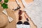 Colorful summer female fashion outfit flat lay. Straw hat, bamboo bag, sunglasses, top view, copy space, wide composition. Summer