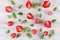 Colorful summer fruit background with slice strawberry and mint leaf, top view.