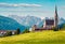 Colorful summer scene of Pfarramt Catholic Church. Bright morning view of the Gosau village in the district of Gmunden in Upper