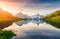 Colorful summer sunrise on Bachalpsee lake with Schreckhorn and