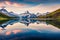 Colorful summer sunrise on Bachalpsee lake with Schreckhorn and