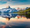 Colorful summer sunrise on Bachalpsee lake with Schreckhorn peak