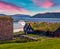 Colorful summer sunrise Hestur Island. Amazing morning view of Kirkjubour village, Faroe Islands, Kingdom of Denmark, Europe.  Tra