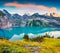 Colorful summer sunrise on the unique Oeschinensee Lake. Splendid morning scene in the Swiss Alps with Bluemlisalp mountain, Kande