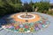 Colorful sundial hand-painted in a floral pattern, folk art, Zalipie, Poland.