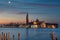 Colorful sunrise at the Giudecca Canal to the island of San Georgio Maggiore, with its campanile and church designed by Palladio,
