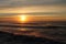 Colorful sunset on atlantic coast with breaking waves in beautiful landscape scenery, capbreton, france