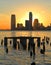 Colorful sunset on Hudson River. Piles from former pier. New York City